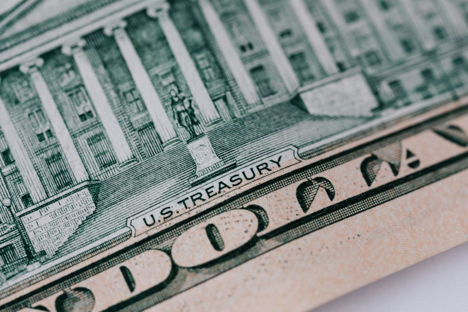Extreme close-up of the U.S. Treasury building engraving on a ten dollar bill